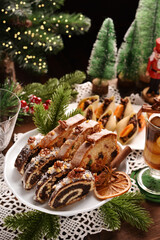 Canvas Print - Christmas poppy seed rolls and stollen cake on festive table