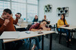 © .shock - A group of diverse people listen to a lecture in business training while sitting in a modern classroom