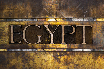 Egypt text with on grunge textured copper and gold background