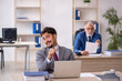© Elnur - Two male colleagues working in the office