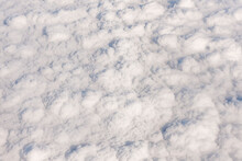 Clouds Seen From Above, From Inside An Airplane, Looking Like A White Cotton Mat Or Smoke