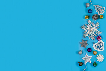 Wall Mural - Christmas decorations, snowflakes on blue background.