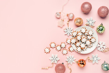 Wall Mural - Christmas glazed star cookies and New Year's decoration on a pink background. Top View. Copy space