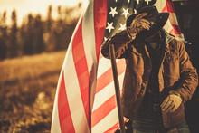 American Cowboy Rancher In Front Of National United States Flag