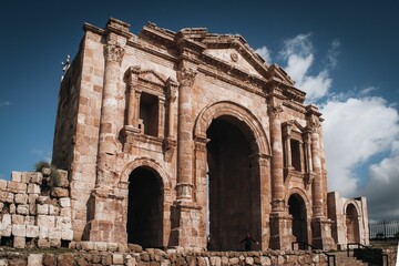 Beautiful view of a building with archways with a blue sky background