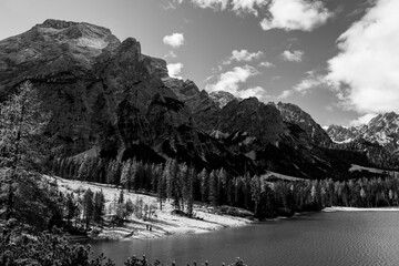 Wall Mural - scenic view of mountain lake against snowcapped Dolomites mountain range