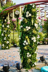 Sticker - Wedding decoration with flowers and lights in the background