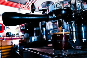 Sticker - Glass cup of coffee under the coffee machine's tap