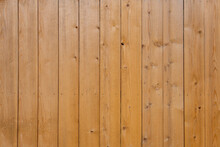 Vertical Wooden Yellow Bars Background. Texture Of The Pine Boards Lie Vertically. Wood Background