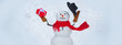 © Volodymyr - Greeting snowman. Handmade snowman. Christmas snowman with Christmas gift. Hello winter. Happy snowman standing in winter Christmas landscape. Happy smiling snow man on sunny winter day, banner