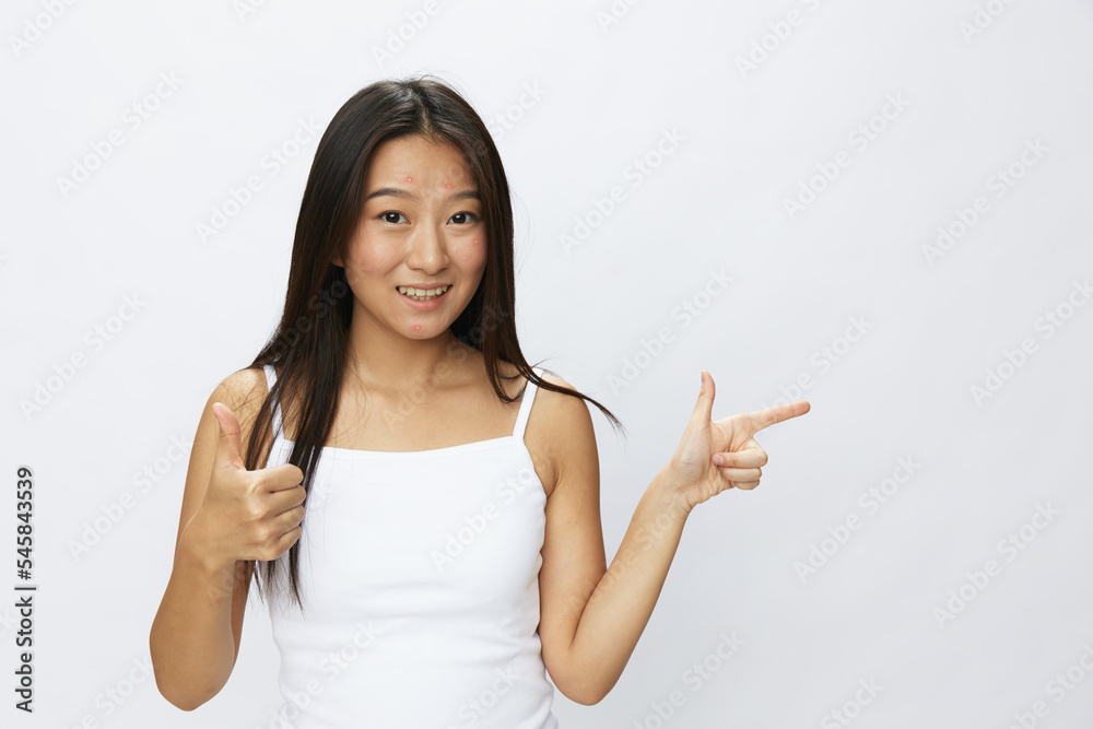 Asian woman hand signals, finger pointing facial skin problems, acne ...