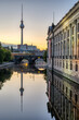 The river Spree, the TV Tower and the facade of the Bode-Museum in Berlin before sunrise