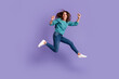 © Tetiana - Full body photo of young excited woman celebrate victory fists hands awesome luck isolated over violet color background