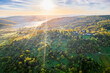 © Westend61 - Germany, Baden-Wurttemberg, Drone view of sun rising over autumn landscape of Remstal valley