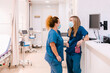 © Westend61 - Mature nurse talking to colleague at hospital
