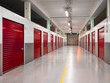 © mark_gusev - Long row of red color doors of self storage facility. Service to keep safe extra belongings. Nobody. Selective focus. Clean and well run business.