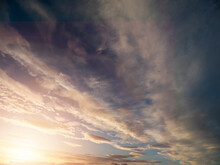 Dramatic Sunset Sky For Design Purpose Of Sky Replacement. Nature Background. Rich Color Tone. Sun Flare.