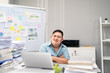 Portrait of Asian young businessman with down syndrome work in office. 