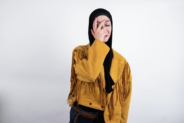  Charismatic carefree joyful young beautiful muslim woman wearing hijab and yellow jacket over white  likes laugh out loud not hiding emotions giggling hear funny hilarious joke chuckling facepalm.