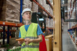 © zinkevych - Experienced warehouse manager inspecting wares on the pallet racks