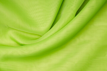 Poster - green silk. wavy background fabric