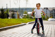 © Ruslan Ivantsov - Little girl on a bicycle in summer park. cycling outdoors