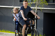 © Ruslan Ivantsov - father riding bike with son in bike seat
