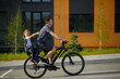 © Ruslan Ivantsov - father riding bike with son in bike seat