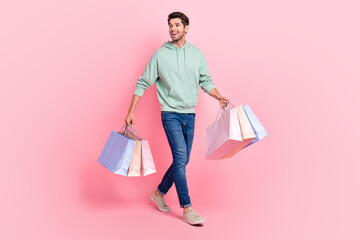 Poster - Full length photo of successful man wear quality khaki trendy jeans outfit interested look empty space isolated on pink color background