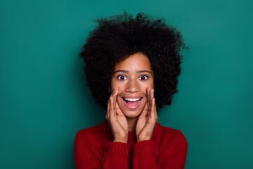 Sticker - Photo of friendly excited little school girl dressed red sweater arms lips making announcement isolated green color background