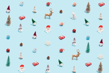 Wall Mural - Trendy Christmas pattern made with various winter and New Year objects on bright light blue background. Minimal Christmas concept.