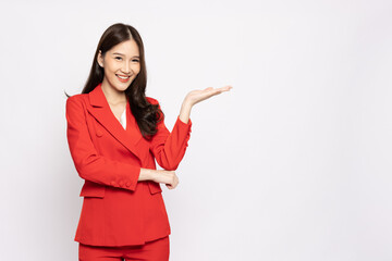 Wall Mural - Happy Asian businesswoman presenting or showing open hand palm with copy space for product isolated over white background