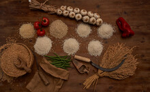 Piles Of Grains And Sickle In Rustic Composition
