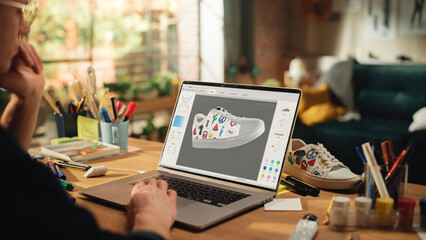 Poster - Close Up of Creative Designer Sitting Behind His Desk in Loft Studio, Working on Shoes Customisation. Living Room with Big Window in Loft Apartment. Next Generation and Trendy Design Concept.