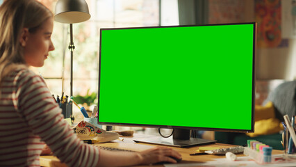 Poster - Blonde Female Creator Modelling on Desktop Computer with Green Screen Chroma Key on Display. Freelancer Woman Working on Her Project, Adding Final Touches Before the Deadline.