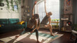 © Gorodenkoff - Young Athletic Couple Exercising, Stretching and Practising Yoga in the Morning in Bright and Sunny Home Living Room. Healthy Lifestyle, Fitness, Wellbeing and Mindfulness Concept.