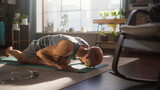 Fototapeta  - Young Athletic Man Exercising, Stretching and Practising Yoga Poses in the Morning in His Bright, Sunny and Spacious Home Living Room. Healthy Lifestyle, Fitness, Wellbeing and Mindfulness Concept.
