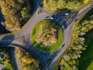 Sticker - Aerial view of a traffic roundabout surrounded by autumn trees (Wales)