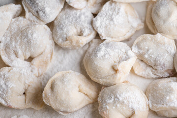 Wall Mural - Blinded dumplings from dough in flour