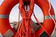 Closeup Of A Lifebuoy With Rope At The Pier Of The Baltic Sea