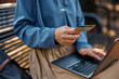 © Drazen - Close up of businesswoman online banking with credit card and laptop.