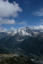 Aerial View Of L'aiguille Verte Mountain In France With Chamonix  In The Valley Below