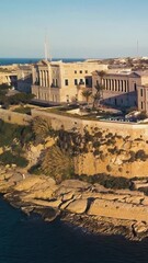 Wall Mural - Vertical aerial view of the beautiful city of Valetta at the seashore in Malta