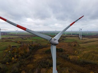 Closeup shot of wind turbines in the agricultural fields