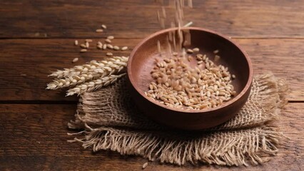 Wall Mural - Wheat grains falling in a bowl in slow motion. Harvest, food produce concept