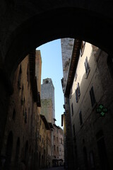 Old narrow alley in San Gimignano, Tuscany Italy