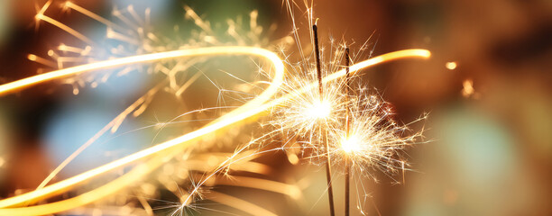 beautiful glowing sparklers at night city, closeup