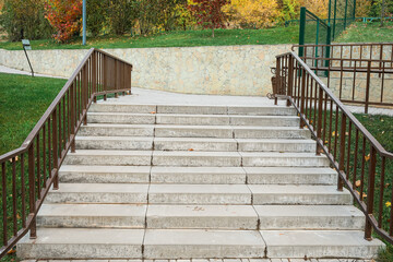 Wall Mural - view of steps with railings in autumn park