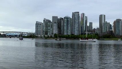 Wall Mural - Panorama of the city - skyscrapers, condos, apartments, a calm lake and a marina. day time