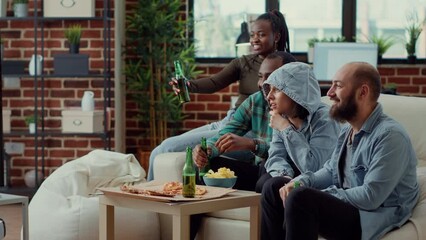 Poster - Diverse friends enjoying comedy movie on tv channel, watching film or tv series on television program. Drinking beer from bottles while they watch show and have fun at home hangout.